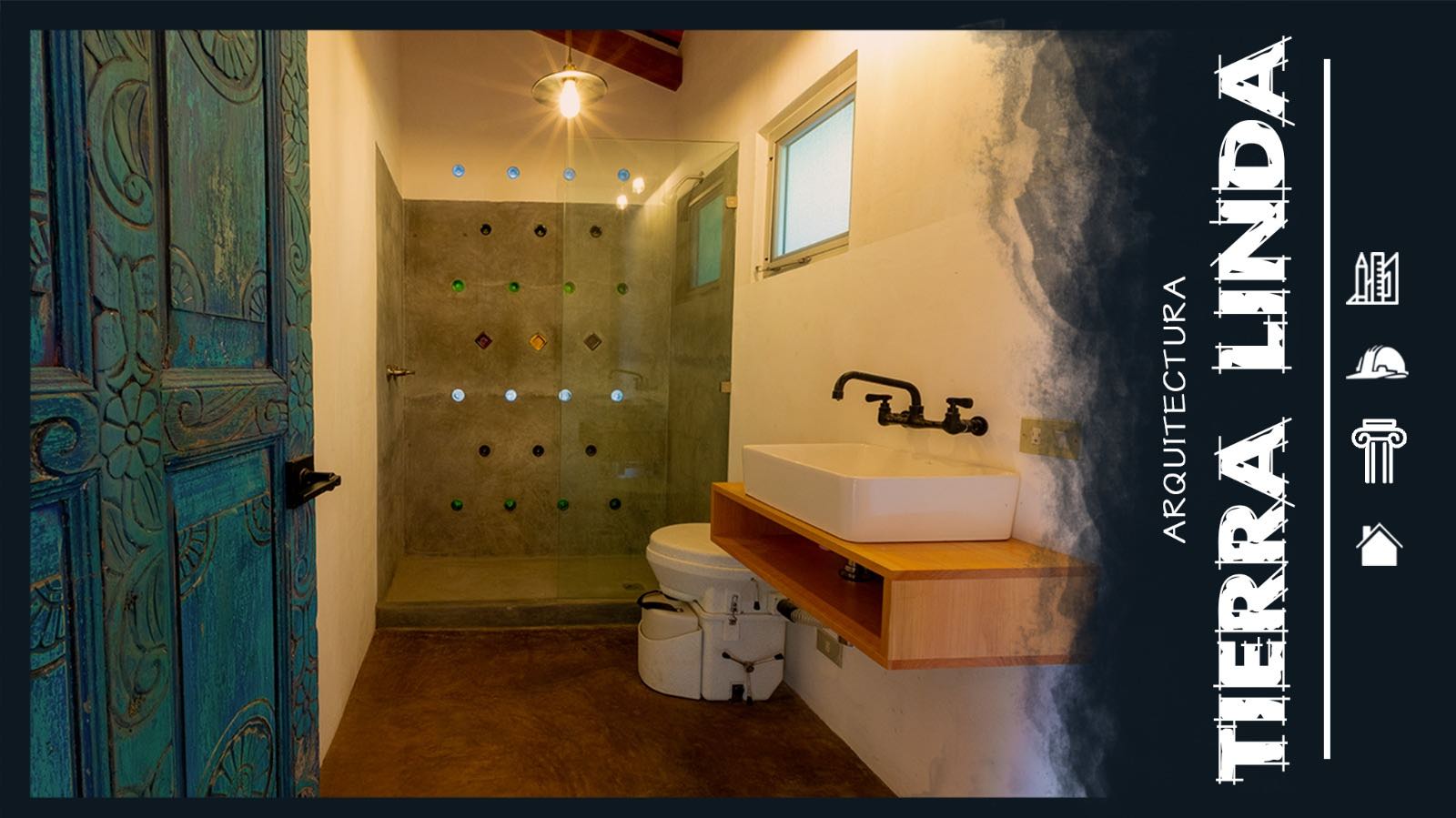 Modern bathroom with a glass shower featuring colorful wall accents, a sleek sink, and a rustic wooden cabinet.