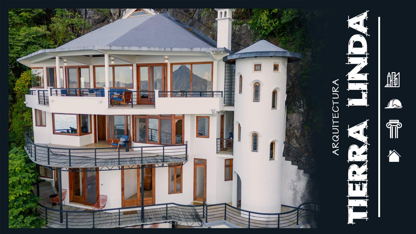 A stunning multi-level structure with panoramic views, stylish balconies, and unique architecture nestled against a lush backdrop.
