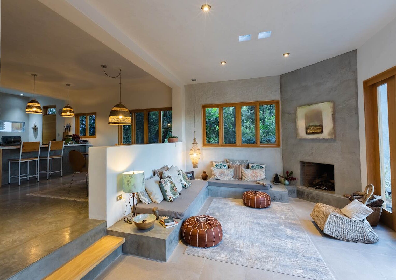Cozy living room featuring a fireplace, comfortable couches, and warm lighting for a welcoming atmosphere.